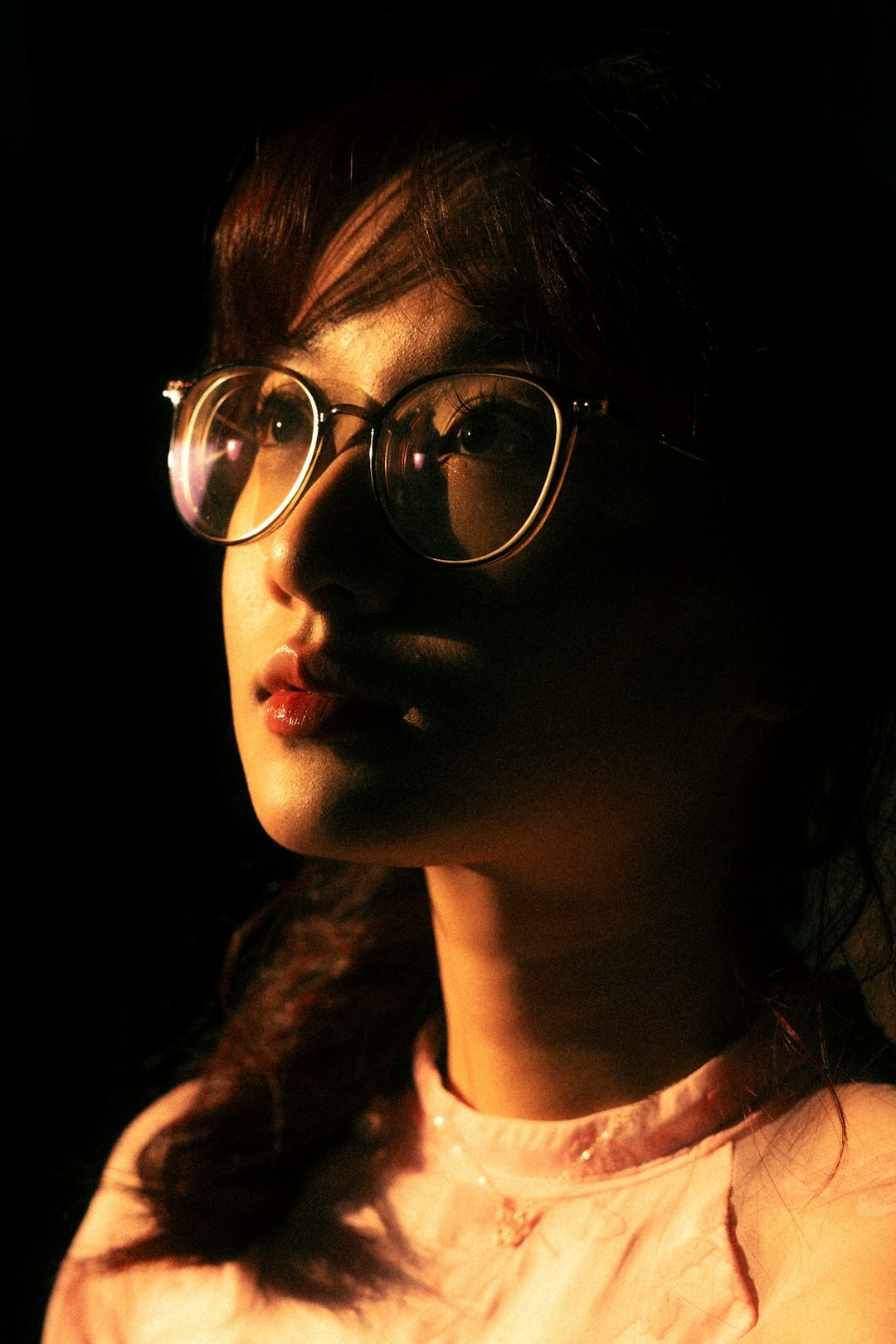 Portrait of a young woman with glasses